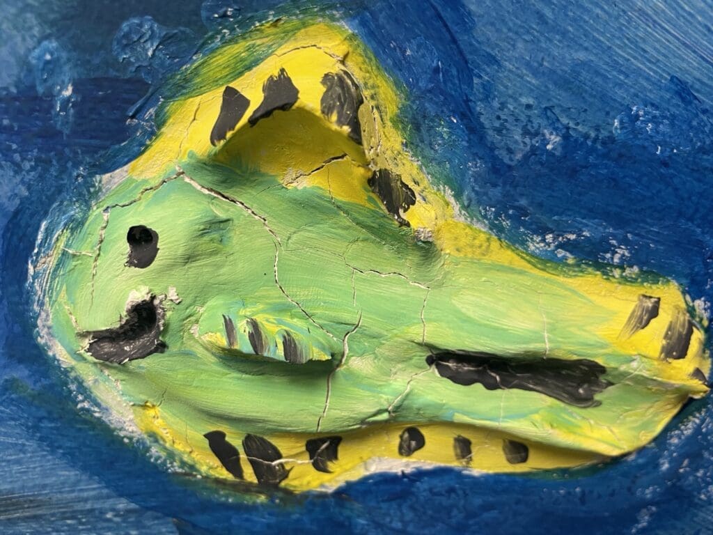 A colorful abstract painting with blue, yellow, and green hues.