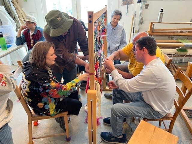 Collaborative weaving activity at loom