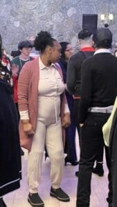 Woman in blush jacket on dance floor