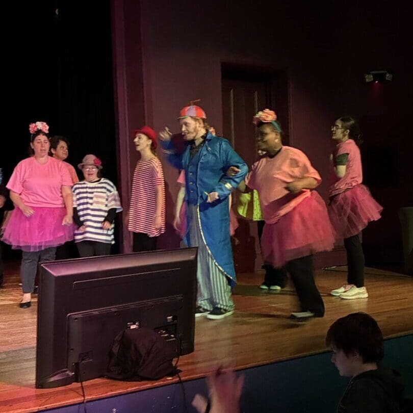 Ensemble in pink tutus and blue tracksuit