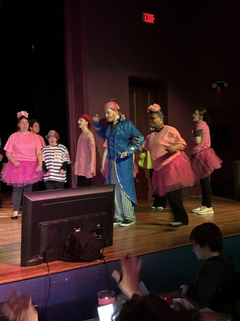 Ensemble in pink tutus and blue tracksuit