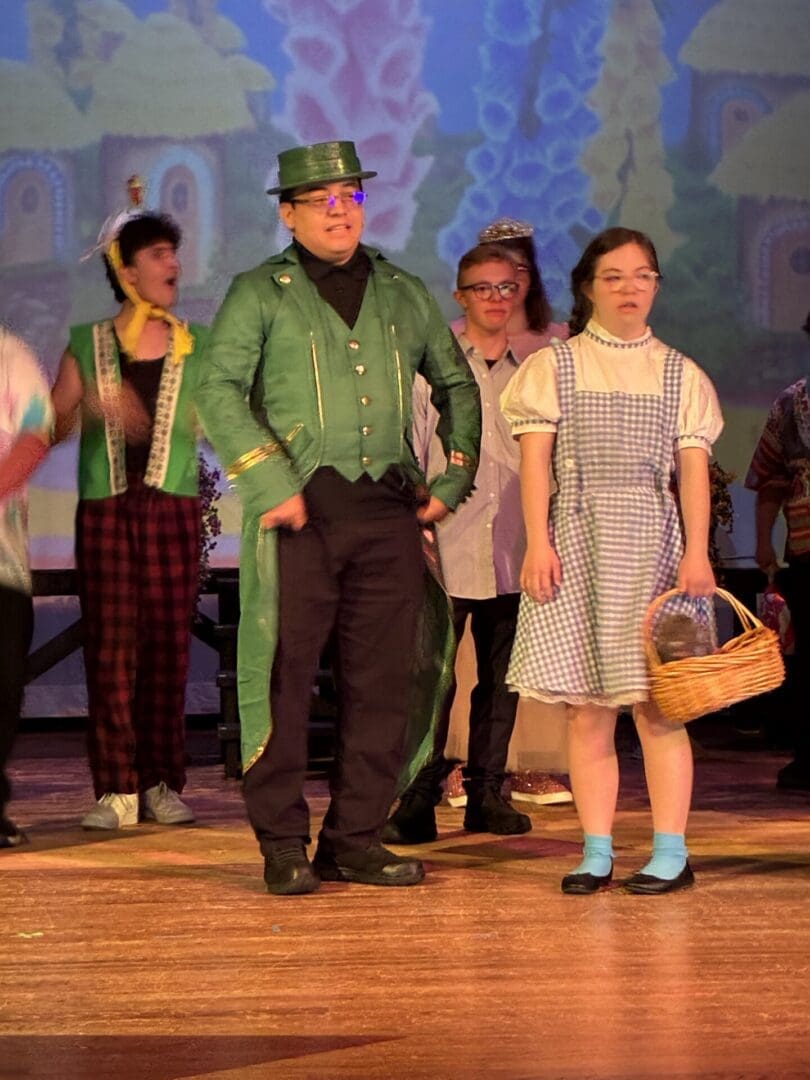 Stage actors in Wizard of Oz costumes