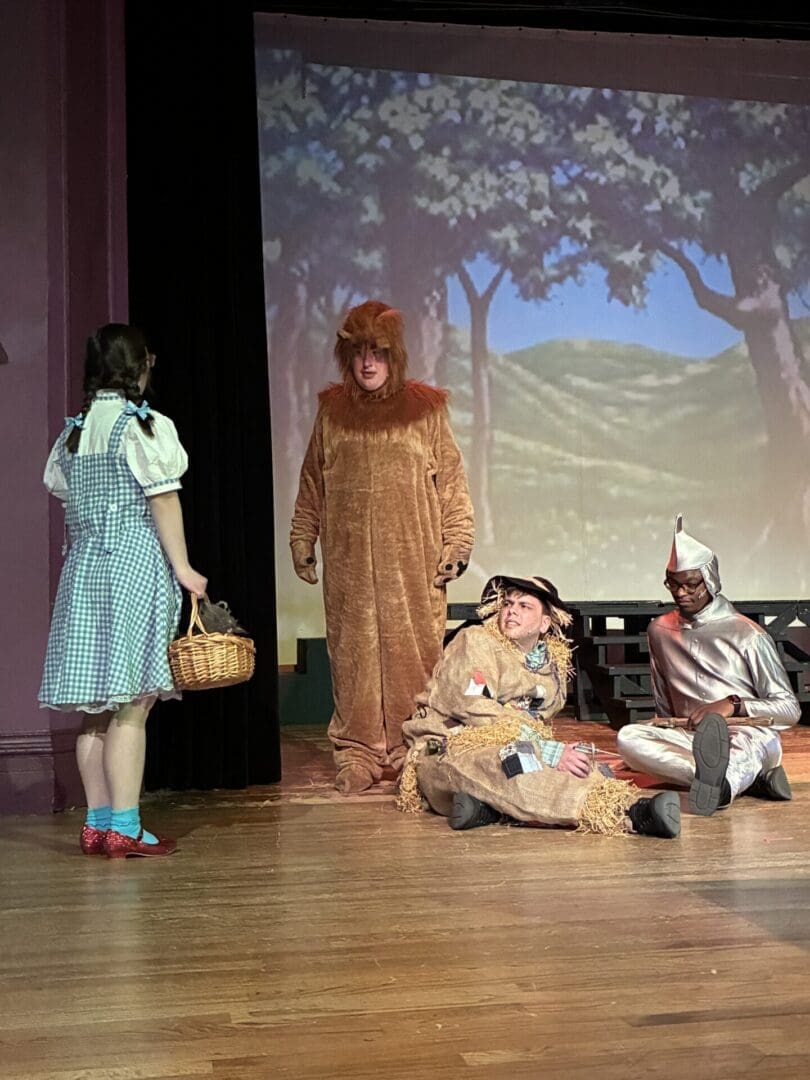 Dorothy with lion, scarecrow, and Tin Man