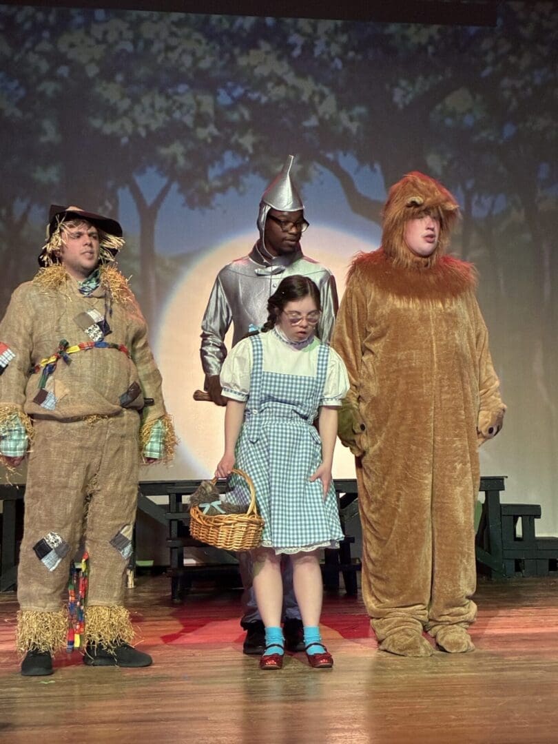 Dorothy with Tin Man, Scarecrow, and Lion